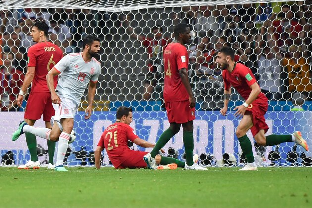 Spain's forward Diego Costa (2L) celebrates after scoring a goal during the Russia 2018 World Cup Group B football match between Portugal and Spain at the Fisht Stadium in Sochi on June 15, 2018. (Photo by Nelson Almeida / AFP) / RESTRICTED TO EDITORIAL USE - NO MOBILE PUSH ALERTS/DOWNLOADS        (Photo credit should read NELSON ALMEIDA/AFP/Getty Images)