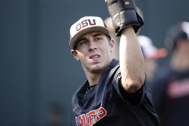 Oregon State pitcher Luke Heimlich works with weights during practice at TD Ameritrade Park in Omaha, Neb., Friday, June 15, 2018. Oregon State plays North Carolina on Saturday in the NCAA College World Series baseball tournament.. (AP Photo/Nati Harnik)