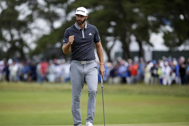 Dustin Johnson reacts after making a putt for birdie on the fourth green during the second round of the U.S. Open Golf Championship, Friday, June 15, 2018, in Southampton, N.Y. (AP Photo/Seth Wenig)
