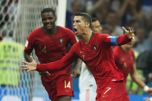 Portugal's forward Cristiano Ronaldo celebrates his third goal during the Russia 2018 World Cup Group B football match between Portugal and Spain at the Fisht Stadium in Sochi on June 15, 2018. (Photo by Odd ANDERSEN / AFP) / RESTRICTED TO EDITORIAL USE - NO MOBILE PUSH ALERTS/DOWNLOADS        (Photo credit should read ODD ANDERSEN/AFP/Getty Images)