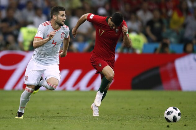 Spain's defender Nacho Fernandez (L) and Portugal's forward Goncalo Guedes compete for the ball during the Russia 2018 World Cup Group B football match between Portugal and Spain at the Fisht Stadium in Sochi on June 15, 2018. (Photo by Odd ANDERSEN / AFP) / RESTRICTED TO EDITORIAL USE - NO MOBILE PUSH ALERTS/DOWNLOADS        (Photo credit should read ODD ANDERSEN/AFP/Getty Images)