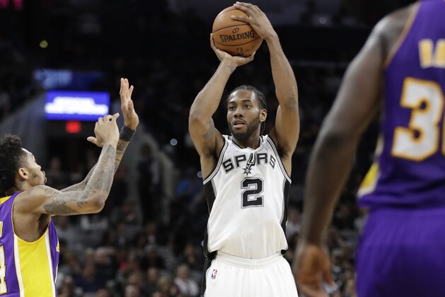 San Antonio Spurs forward Kawhi Leonard (2) shoots past Los Angeles Lakers forward Brandon Ingram, left, during the second half of an NBA basketball game, Thursday, Jan. 12, 2017, in San Antonio. San Antonio Spurs won 134-94. (AP Photo/Eric Gay)