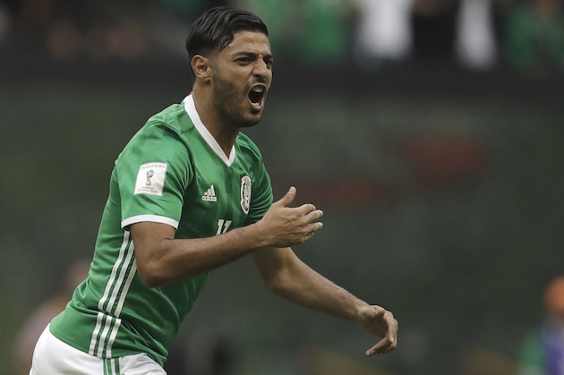 Mexico's Carlos Vela celebrates after scoring his team's first goal against the U.S. during their World Cup soccer qualifying match at Azteca Stadium in Mexico City, Sunday, June 11, 2017.(AP Photo/Rebecca Blackwell)