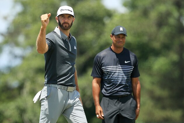 SOUTHAMPTON, NY - JUNE 15:  Dustin Johnson of the United States celebrates making a birdie on the seventh hole as Tiger Woods of the United States looks on during the second round of the 2018 U.S. Open at Shinnecock Hills Golf Club on June 15, 2018 in Southampton, New York.  (Photo by Mike Ehrmann/Getty Images)
