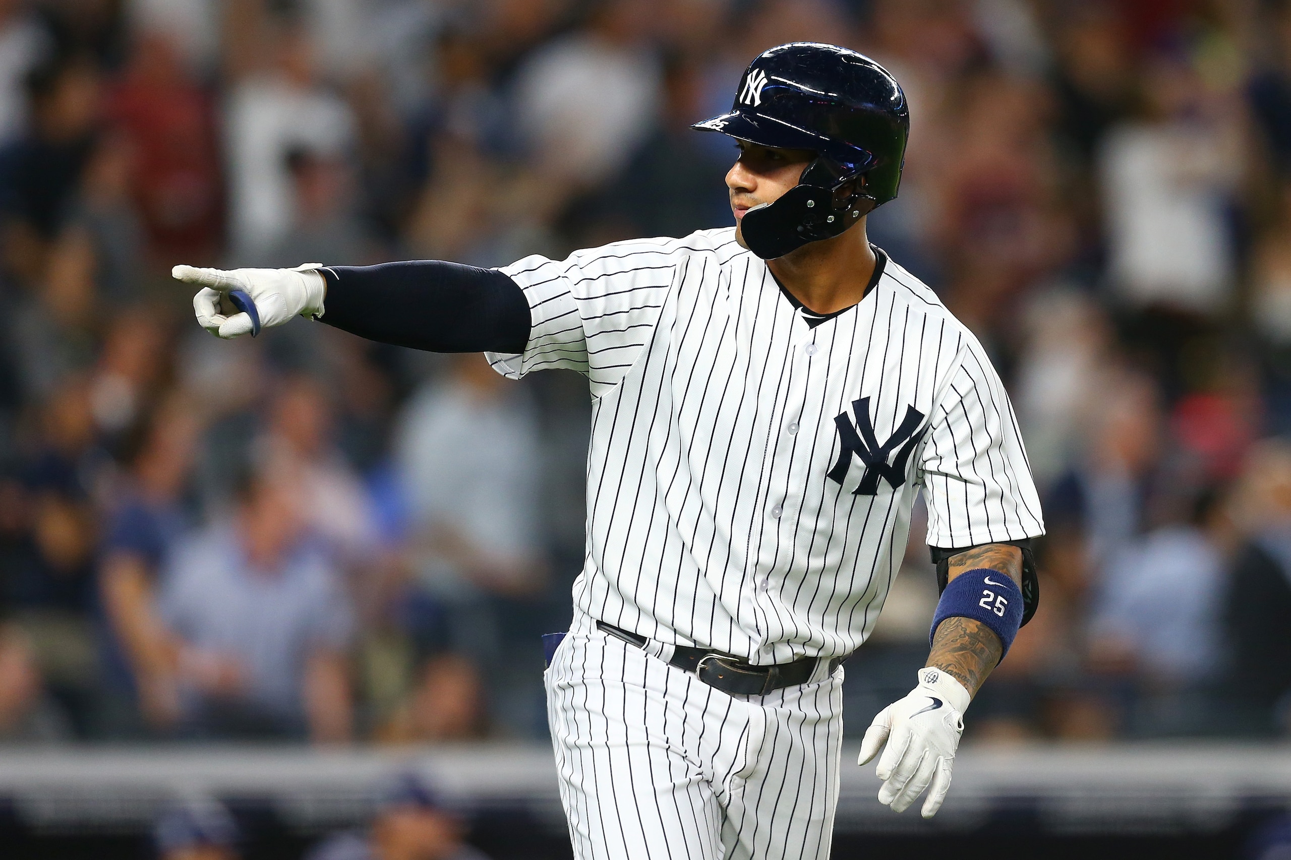 NEW YORK, NY - JUNE 14:  Gleyber Torres #25 of the New York Yankees points to the dugout after hitting a 3-run home run in the fifth inning against the Tampa Bay Rays at Yankee Stadium on June 14, 2018 in the Bronx borough of New York City.  (Photo by Mike Stobe/Getty Images)