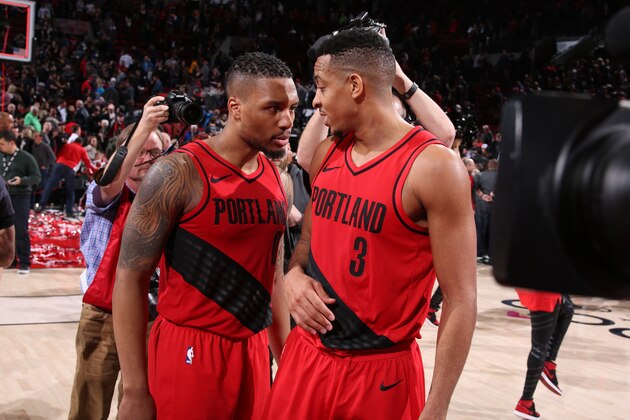PORTLAND, OR - FEBRUARY 14: Damian Lillard #0 of the Portland Trail Blazers and CJ McCollum #3 of the Portland Trail Blazers speak after the game against the Golden State Warriors on February 14, 2018 at the Moda Center Arena in Portland, Oregon. NOTE TO USER: User expressly acknowledges and agrees that, by downloading and or using this photograph, user is consenting to the terms and conditions of the Getty Images License Agreement. Mandatory Copyright Notice: Copyright 2018 NBAE (Photo by Sam Forencich/NBAE via Getty Images) PORTLAND, OR - FEBRUARY 14: Damian Lillard #0 of the Portland Trail Blazers and CJ McCollum #3 of the Portland Trail Blazers speak after the game against the Golden State Warriors on February 14, 2018 at the Moda Center Arena in Portland, Oregon. NOTE TO USER: User expressly acknowledges and agrees that, by downloading and or using this photograph, user is consenting to the terms and conditions of the Getty Images License Agreement. Mandatory Copyright Notice: Copyright 2018 NBAE (Photo by Sam Forencich/NBAE via Getty Images)
