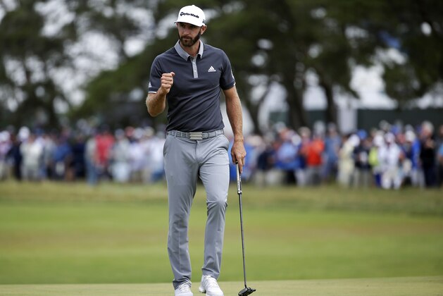 Dustin Johnson reacts after making a putt for birdie on the fourth green during the second round of the U.S. Open Golf Championship, Friday, June 15, 2018, in Southampton, N.Y. (AP Photo/Seth Wenig)