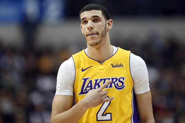 Los Angeles Lakers guard Lonzo Ball (2) signals to a teammate during an offensive possession against the Dallas Mavericks in the first half of an NBA basketball game, Saturday, Jan. 13, 2018, in Dallas. (AP Photo/Tony Gutierrez)