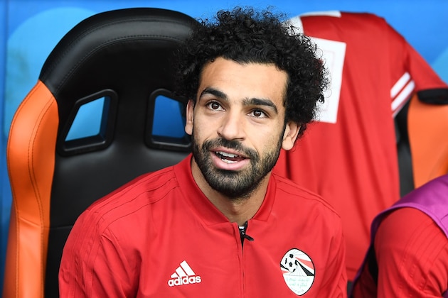 Egypt's forward Mohamed Salah is seen on the substitutes bench before kick off of the Russia 2018 World Cup Group A football match between Egypt and Uruguay at the Ekaterinburg Arena in Ekaterinburg on June 15, 2018. (Photo by Anne-Christine POUJOULAT / AFP) / RESTRICTED TO EDITORIAL USE - NO MOBILE PUSH ALERTS/DOWNLOADS        (Photo credit should read ANNE-CHRISTINE POUJOULAT/AFP/Getty Images)
