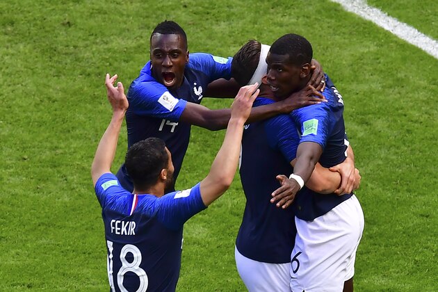 France's players hug France's midfielder Paul Pogba (R) to celebrate after scoring their second goal during the Russia 2018 World Cup Group C football match between France and Australia at the Kazan Arena in Kazan on June 16, 2018. (Photo by Luis Acosta / AFP) / RESTRICTED TO EDITORIAL USE - NO MOBILE PUSH ALERTS/DOWNLOADS        (Photo credit should read LUIS ACOSTA/AFP/Getty Images)