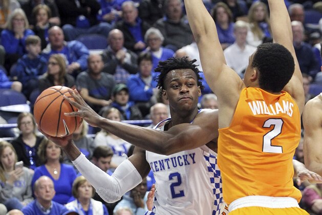 Kentucky's Jarred Vanderbilt, left, looks for an opening on Tennessee's Grant Williams during the first half of an NCAA college basketball game, Tuesday, Feb. 6, 2018, in Lexington, Ky. (AP Photo/James Crisp)