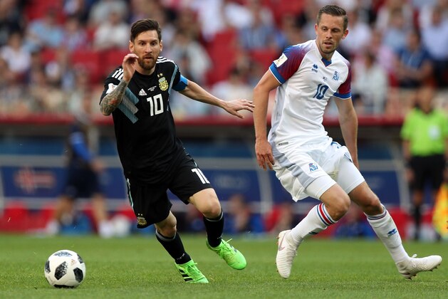 MOSCOW, RUSSIA - JUNE 16:  Lionel Messi of Argentina and Gylfi Sigurdsson of Iceland in action during the 2018 FIFA World Cup Russia group D match between Argentina and Iceland at Spartak Stadium on June 16, 2018 in Moscow, Russia.  (Photo by Amin Mohammad Jamali/Getty Images)