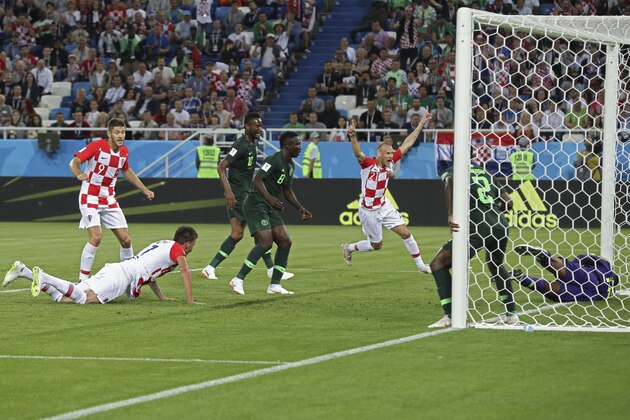 Croatia's Domagoj Vida, fifth left, celebrates after Nigeria's Oghenekaro Etebo, fourth left, scored an own goal during the group D match between Croatia and Nigeria at the 2018 soccer World Cup in the Kaliningrad Stadium in Kaliningrad, Russia, Saturday, June 16, 2018. (AP Photo/Czarek Sokolowski)