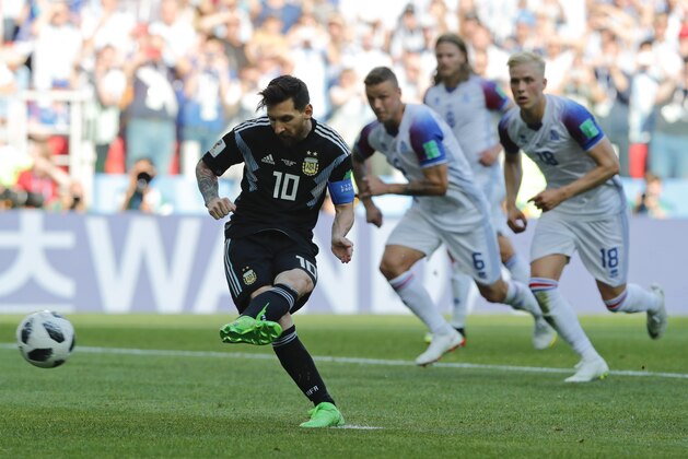 Argentina's Lionel Messi kicks a penalty during the group D match between Argentina and Iceland at the 2018 soccer World Cup in the Spartak Stadium in Moscow, Russia, Saturday, June 16, 2018. (AP Photo/Ricardo Mazalan)