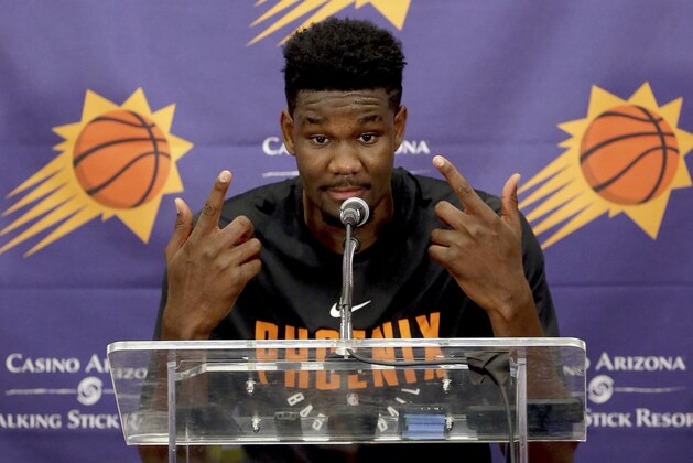 NBA Draft prospect Deandre Ayton, who may be the Phoenix Suns' choice with the No. 1 overall pick in this month's NBA draft, talks to the media after an individual workout with the Suns, Wednesday, June 6, 2018 in Phoenix. (AP Photo/Matt York)