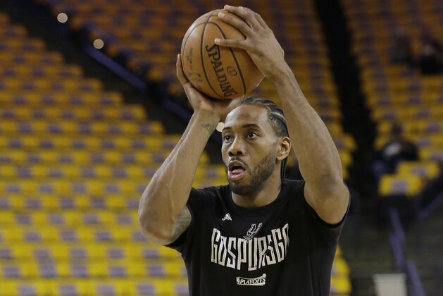 San Antonio Spurs forward Kawhi Leonard warms up before Game 1 of the NBA basketball Western Conference finals against the Golden State Warriors in Oakland, Calif., Sunday, May 14, 2017. (AP Photo/Jeff Chiu)