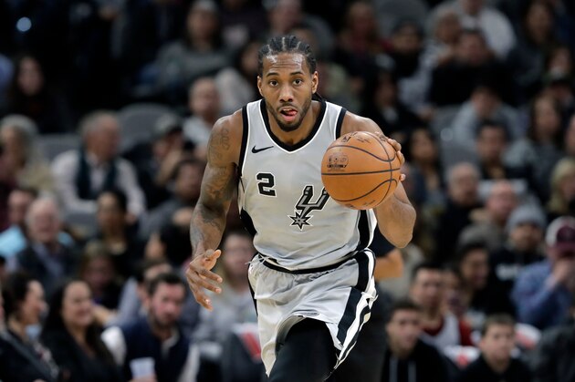 FILE - In this Jan. 13, 2018, file photo, San Antonio Spurs forward Kawhi Leonard (2) moves the ball up court during the second half of an NBA basketball game against the Denver Nuggets, in San Antonio. The absolute unwillingness to answer certain questions is part of the San Antonio Spurs' mystique. The Spurs just don't share much. So there is some unmistakable irony here that when it comes to the obviously fractured relationship between San Antonio and Kawhi Leonard, it's the Spurs who are the ones frustrated by the lack of answers. (AP Photo/Eric Gay, File)