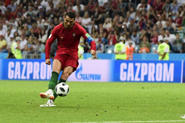 TOPSHOT - Portugal's forward Cristiano Ronaldo celebrates his third goal during the Russia 2018 World Cup Group B football match between Portugal and Spain at the Fisht Stadium in Sochi on June 15, 2018. (Photo by PIERRE-PHILIPPE MARCOU / AFP) / RESTRICTED TO EDITORIAL USE - NO MOBILE PUSH ALERTS/DOWNLOADS        (Photo credit should read PIERRE-PHILIPPE MARCOU/AFP/Getty Images)