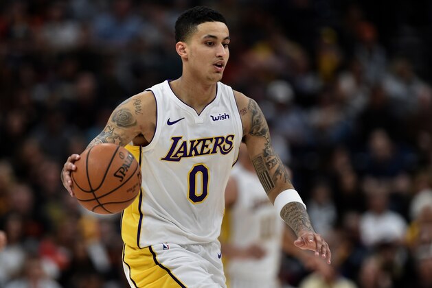 SALT LAKE CITY, UT - APRIL 03: Kyle Kuzma #0 of the Los Angeles Lakers brings the ball up court in the first half of a game against the Utah Jazz at Vivint Smart Home Arena on April 3, 2018 in Salt Lake City, Utah. NOTE TO USER: User expressly acknowledges and agrees that, by downloading and or using this photograph, User is consenting to the terms and conditions of the Getty Images License Agreement. (Photo by Gene Sweeney Jr./Getty Images)