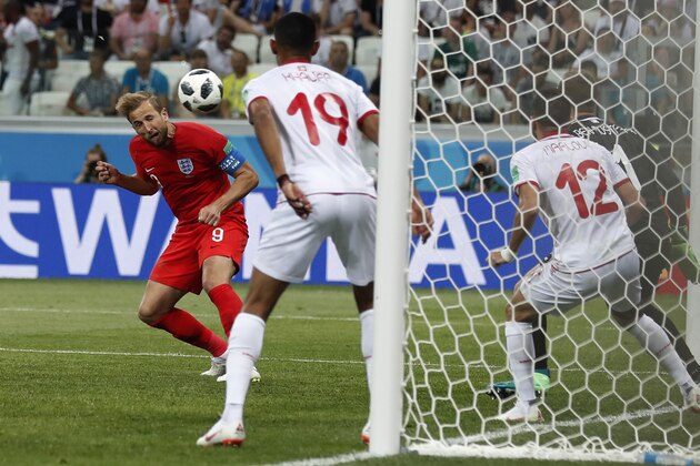 England's Harry Kane scores his side's 2nd goal against Tunisia during a group G match at the 2018 soccer World Cup in the Volgograd Arena in Volgograd, Russia, Monday, June 18, 2018. (AP Photo/Alastair Grant)