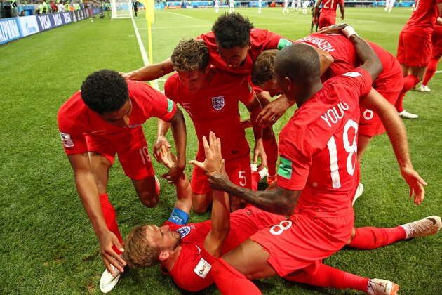 VOLGOGRAD, RUSSIA - JUNE 18:  Harry Kane of England celebrates with his team-mates after scoring a goal to make it 1-2  during the 2018 FIFA World Cup Russia group G match between Tunisia and England at Volgograd Arena on June 18, 2018 in Volgograd, Russia. (Photo by Robbie Jay Barratt - AMA/Getty Images)