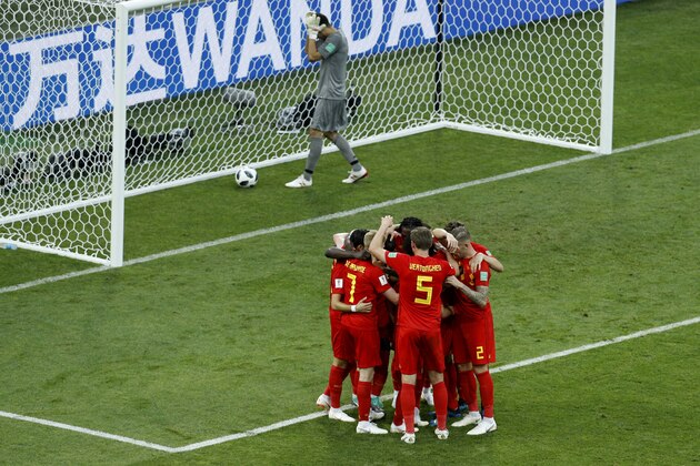 Belgium players celebrate after Romelo Lukaku scored their side's second goal as Panama goalkeeper Jaime Penedo, top, picks the ball inside the goal during the group G match between Belgium and Panama at the 2018 soccer World Cup in the Fisht Stadium in Sochi, Russia, Monday, June 18, 2018. (AP Photo/Victor R. Caivano)
