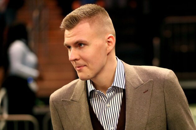 NEW YORK, NY - MARCH 13:  Kristaps Porzingis #6 of the New York Knicks is welcomed back after tearing his ACL previously in the season prior to taking on the Dallas Mavericks during their game at Madison Square Garden on March 13, 2018 in New York City. NOTE TO USER: User expressly acknowledges and agrees that, by downloading and or using this photograph, User is consenting to the terms and conditions of the Getty Images License Agreement.  (Photo by Abbie Parr/Getty Images)