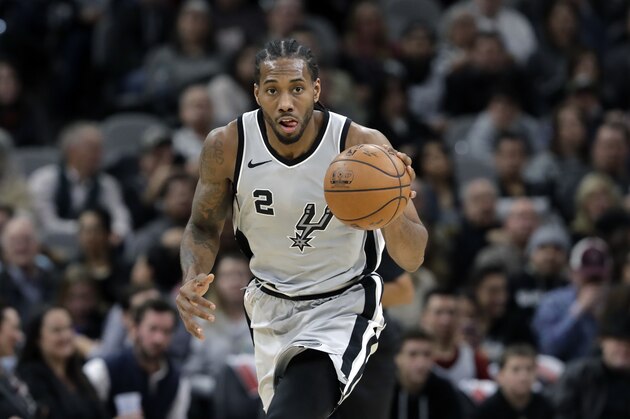 San Antonio Spurs forward Kawhi Leonard (2) moves the ball up court during the second half of an NBA basketball game against the Denver Nuggets, Saturday, Jan. 13, 2018, in San Antonio. San Antonio won 112-80. (AP Photo/Eric Gay)