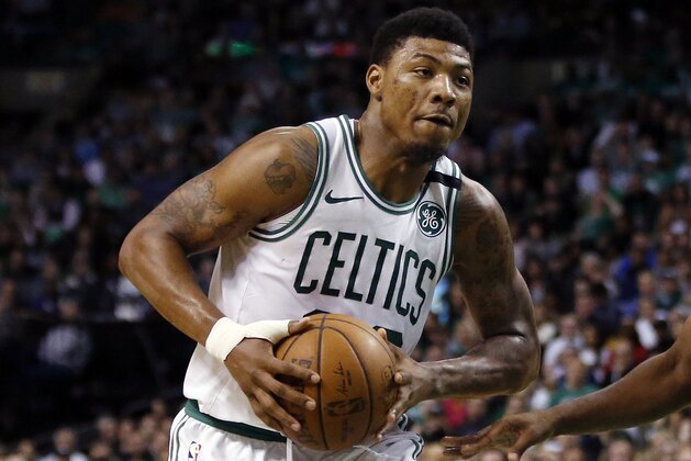 Boston Celtics guard Marcus Smart drives against the Cleveland Cavaliers during Game 1 of the NBA basketball Eastern Conference Finals, Sunday, May 13, 2018, in Boston. (AP Photo/Michael Dwyer)