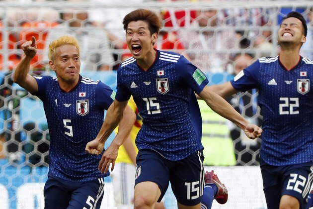 Japan's forward Yuya Osako (C) celebrates with teammates after scoring a goal during the Russia 2018 World Cup Group H football match between Colombia and Japan at the Mordovia Arena in Saransk on June 19, 2018. (Photo by Jack GUEZ / AFP) / RESTRICTED TO EDITORIAL USE - NO MOBILE PUSH ALERTS/DOWNLOADS        (Photo credit should read JACK GUEZ/AFP/Getty Images)