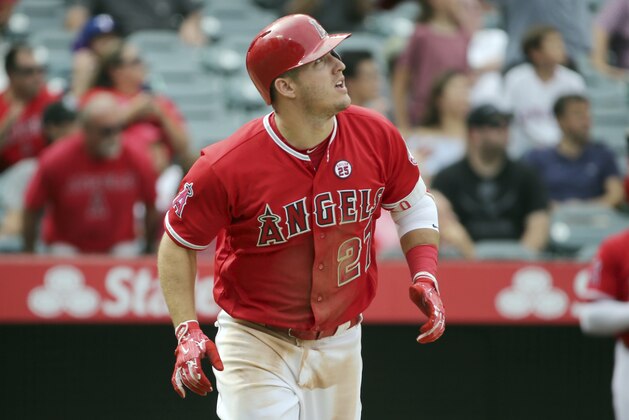 Los Angeles Angels' Mike Trout watches his solo home run against the Texas Rangers in the eighth inning of a baseball game in Anaheim, Calif., Sunday, Sept. 17, 2017. (AP Photo/Reed Saxon)