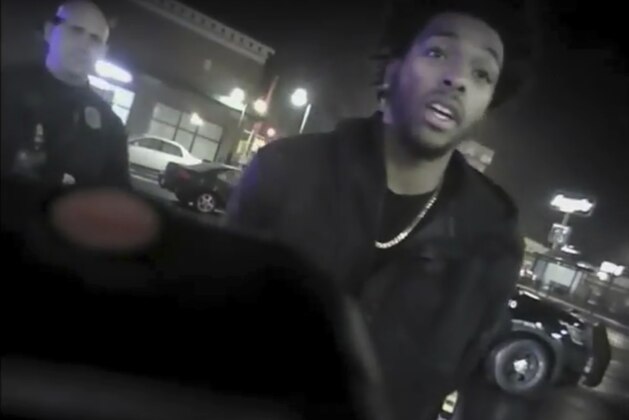 This Jan. 26, 2018 police body-camera footage released by Milwaukee Police Department shows NBA Bucks guard Sterling Brown as he talks to arresting police officers after being shot by a stun gun in a Walgreens parking lot in Milwaukee. The release comes as city officials who've viewed the videos have expressed concern about how officers conducted themselves. Even leaders of the police department have hinted the video may make them look bad. (Milwaukee Police Department via AP)