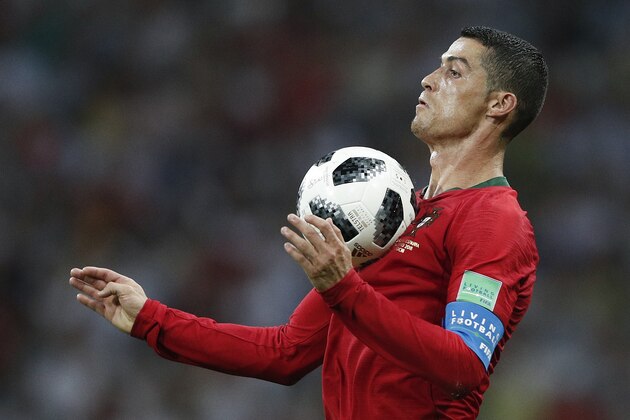 TOPSHOT - Portugal's forward Cristiano Ronaldo controls the ball during the Russia 2018 World Cup Group B football match between Portugal and Spain at the Fisht Stadium in Sochi on June 15, 2018. (Photo by Adrian DENNIS / AFP) / RESTRICTED TO EDITORIAL USE - NO MOBILE PUSH ALERTS/DOWNLOADS        (Photo credit should read ADRIAN DENNIS/AFP/Getty Images)