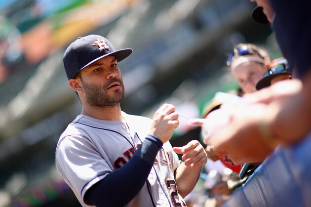 OAKLAND, CA - JUNE 14:  Jose Altuve #27 of the Houston Astros signs autographs before their game against the Oakland Athletics at Oakland Alameda Coliseum on June 14, 2018 in Oakland, California.  (Photo by Ezra Shaw/Getty Images)