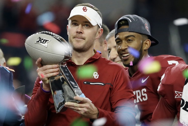 Oklahoma head coach Lincoln Riley holds the Big 12 Conference championship NCAA college football game trophy after Oklahoma defeated TCU on Saturday, Dec. 2, 2017, in Arlington, Texas. (AP Photo/Tony Gutierrez)