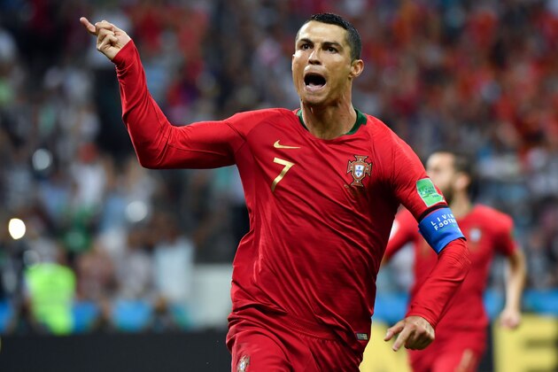 Portugal's forward Cristiano Ronaldo celebrates a goal after shooting a penalty kick during the Russia 2018 World Cup Group B football match between Portugal and Spain at the Fisht Stadium in Sochi on June 15, 2018. (Photo by Nelson Almeida / AFP) / RESTRICTED TO EDITORIAL USE - NO MOBILE PUSH ALERTS/DOWNLOADS        (Photo credit should read NELSON ALMEIDA/AFP/Getty Images)