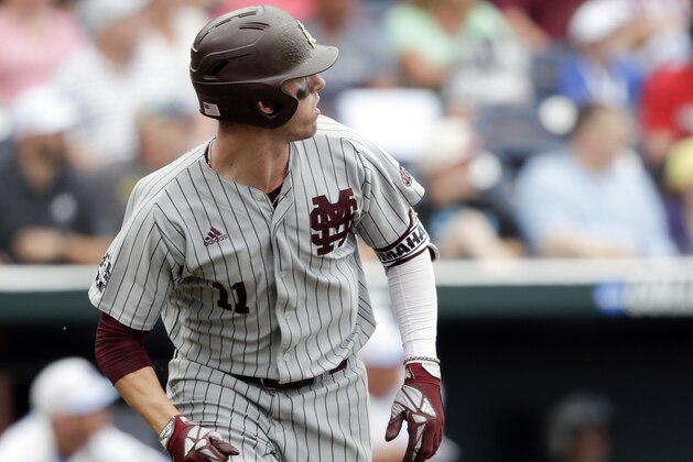 Mississippi State designated hitter Jordan Westburg follows the trajectory of his grand slam ball, in the second inning of an NCAA College World Series baseball game against North Carolina in Omaha, Neb., Tuesday, June 19, 2018. (AP Photo/Nati Harnik)