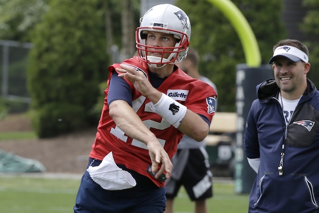 New England Patriots quarterback Tom Brady (12) follows through on a pass as offensive coordinator Josh McDaniels, right, looks on during an NFL football minicamp practice, Thursday, June 7, 2018, in Foxborough, Mass. (AP Photo/Steven Senne)