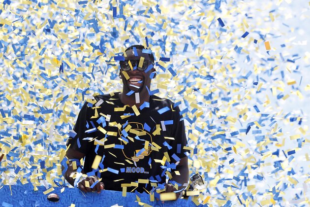Confetti comes down on Golden State Warriors' Draymond Green (23) is surrounded by confetti during the team's NBA basketball championship parade, Tuesday, June 12, 2018, in Oakland, Calif. (AP Photo/Tony Avelar)