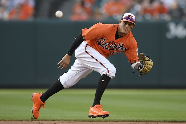 Baltimore Orioles shortstop Manny Machado (13) fields a ball that went for a single by Miami Marlins' JT Riddle during the ninth inning of a baseball game, Saturday, June 16, 2018, in Baltimore. (AP Photo/Nick Wass) Baltimore Orioles shortstop Manny Machado (13) fields a ball that went for a single by Miami Marlins' JT Riddle during the ninth inning of a baseball game, Saturday, June 16, 2018, in Baltimore. (AP Photo/Nick Wass)