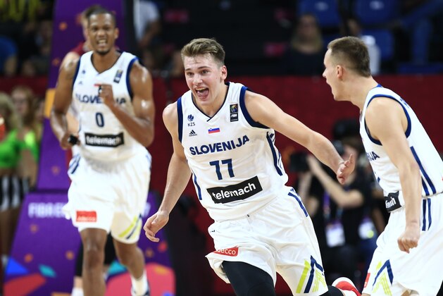 Slovenia's Luka Doncic, center, celebrates with teammates during their Eurobasket European Basketball Championship quarter final match against Latvia, in Istanbul, Tuesday, Sept. 12. 2017. (AP Photo/Lefteris Pitarakis)