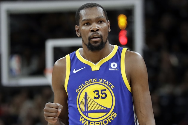 Golden State Warriors forward Kevin Durant celebrates a basket against the San Antonio Spurs during the first half of Game 3 of a first-round NBA basketball playoff series in San Antonio, Thursday, April 19, 2018. (AP Photo/Eric Gay)