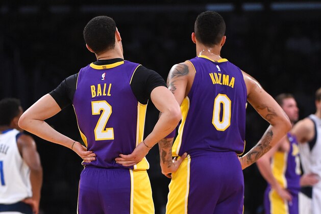 LOS ANGELES, CA - MARCH 28:  Kyle Kuzma #0 and Lonzo Ball #2 of the Los Angeles Lakers wait on the court during a time out in the game against the Dallas Mavericks at Staples Center on March 28, 2018 in Los Angeles, California.  (Photo by Jayne Kamin-Oncea/Getty Images)  NOTE TO USER: User expressly acknowledges and agrees that, by downloading and or using this photograph, User is consenting to the terms and conditions of the Getty Images License Agreement.