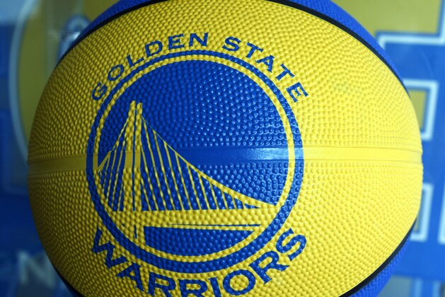 The new Golden State Warrior logo is seen on a basketball for sale at the Warrior team store Wednesday, July 14, 2010, in Oakland, Calif.  Golden State Warriors owner Chris Cohan reached an agreement Thursday to sell the franchise for a record $450 million to Boston Celtics minority partner Joe Lacob and Mandalay Entertainment CEO Peter Guber. (AP Photo/Ben Margot)