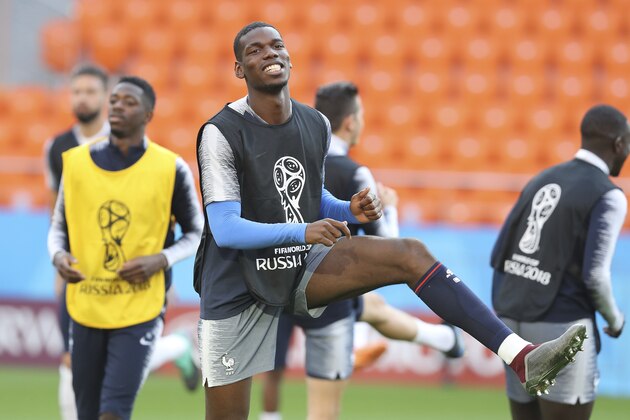 France's Paul Pogba warms up during France's official training at the eve of the group C match between France and Peru at the 2018 soccer World Cup in Yekaterinburg, Russia, Wednesday, June 20, 2018. (AP Photo/David Vincent)