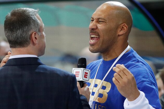 FILE - In this Jan. 9, 2018, file photo, LaVar Ball is interviewed after a basketball game in Prienai, Lithuania. LiAngelo and LaMelo Ball are leaving their Lithuania team by mutual agreement. BC Prienu Vytautas on Thursday, April 26, 2018, announced the departure of the younger brothers of Los Angeles Lakers rookie Lonzo Ball. Lithuanian basketball writer Donatas Urbonas says on Twitter that father LaVar Ball told him he was upset over LaMelo's diminished playing time. (AP Photo/Liusjenas Kulbis, File)