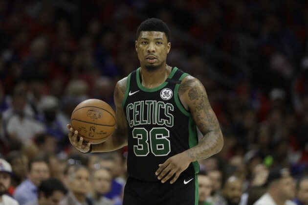 Boston Celtics' Marcus Smart in action during Game 4 of an NBA basketball second-round playoff series against the Philadelphia 76ers, Monday, May 7, 2018, in Philadelphia. (AP Photo/Matt Slocum)
