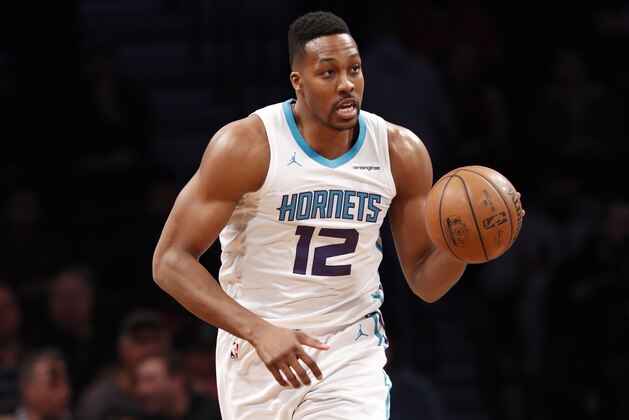 Charlotte Hornets center Dwight Howard (12) moves the ball down court during the first half of an NBA basketball game against the Brooklyn Nets, Wednesday, March 21, 2018, in New York. (AP Photo/Kathy Willens)