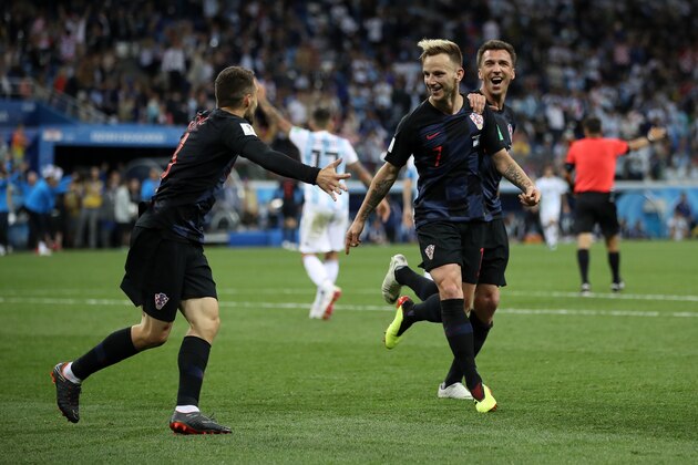 NIZHNY NOVGOROD, RUSSIA - JUNE 21:  Ivan Rakitic of Croatia celebrates with teammates Mateo Kovacic and Mario Mandzukic of Croatia after scoring his team's third goal during the 2018 FIFA World Cup Russia group D match between Argentina and Croatia at Nizhny Novgorod Stadium on June 21, 2018 in Nizhny Novgorod, Russia.  (Photo by Clive Brunskill/Getty Images)