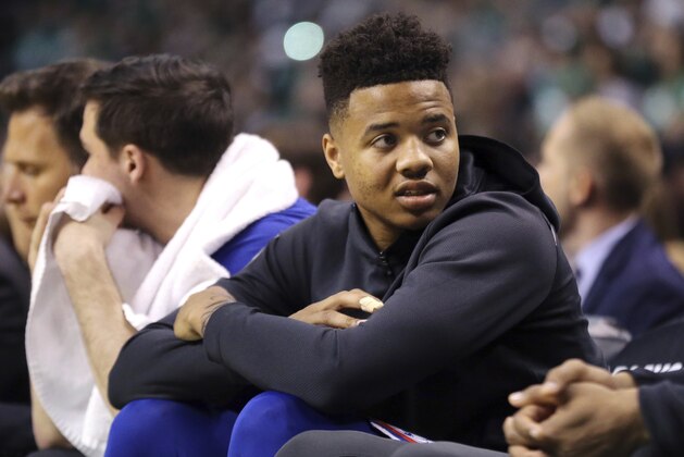 In this April 30, 2018, photo, Philadelphia 76ers guard Markelle Fultz watches from the bench during Game 1 of an NBA basketball second-round playoff series against the Boston Celtics, in Boston. The Celtics surprised many last June when they passed on drafting Fultz with the No. 1 overall pick and instead traded it to the 76ers for the third pick and a future first rounder. (AP Photo/Elise Amendola)